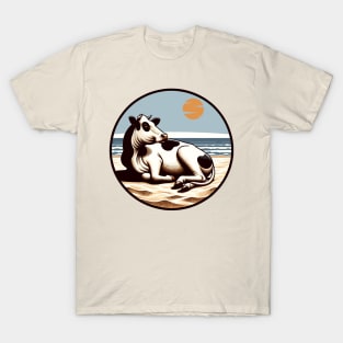 Cow lying on the beach T-Shirt